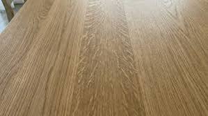 Close-up of white oak plank grain showing tight, closed pores