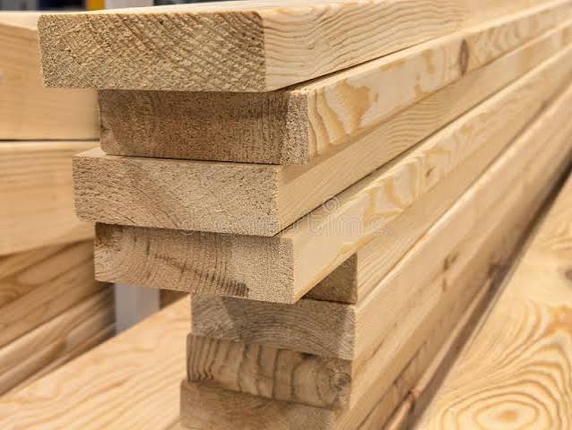 Stack of freshly milled pine lumber boards