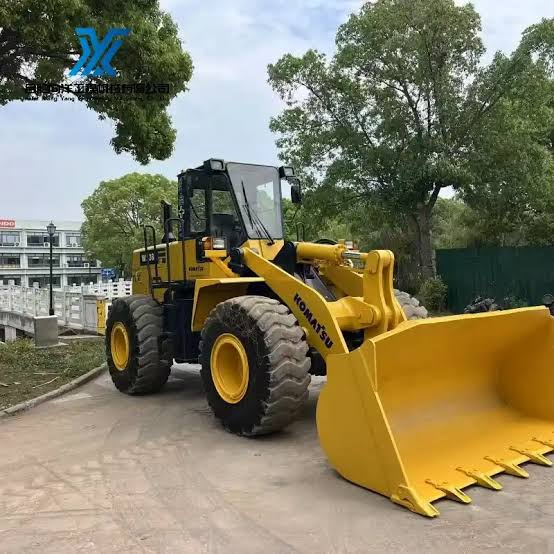 Used loader undergoing mechanical inspection