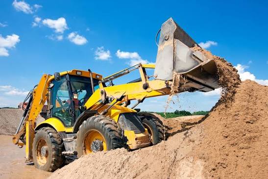 Used loader working on a construction or yard site