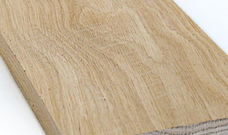 Close-up of the grain pattern on a milled white oak board