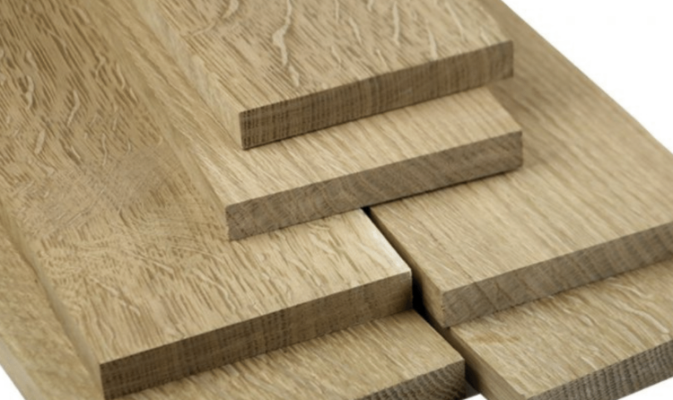 Stack of prefinished white oak flooring planks ready for install